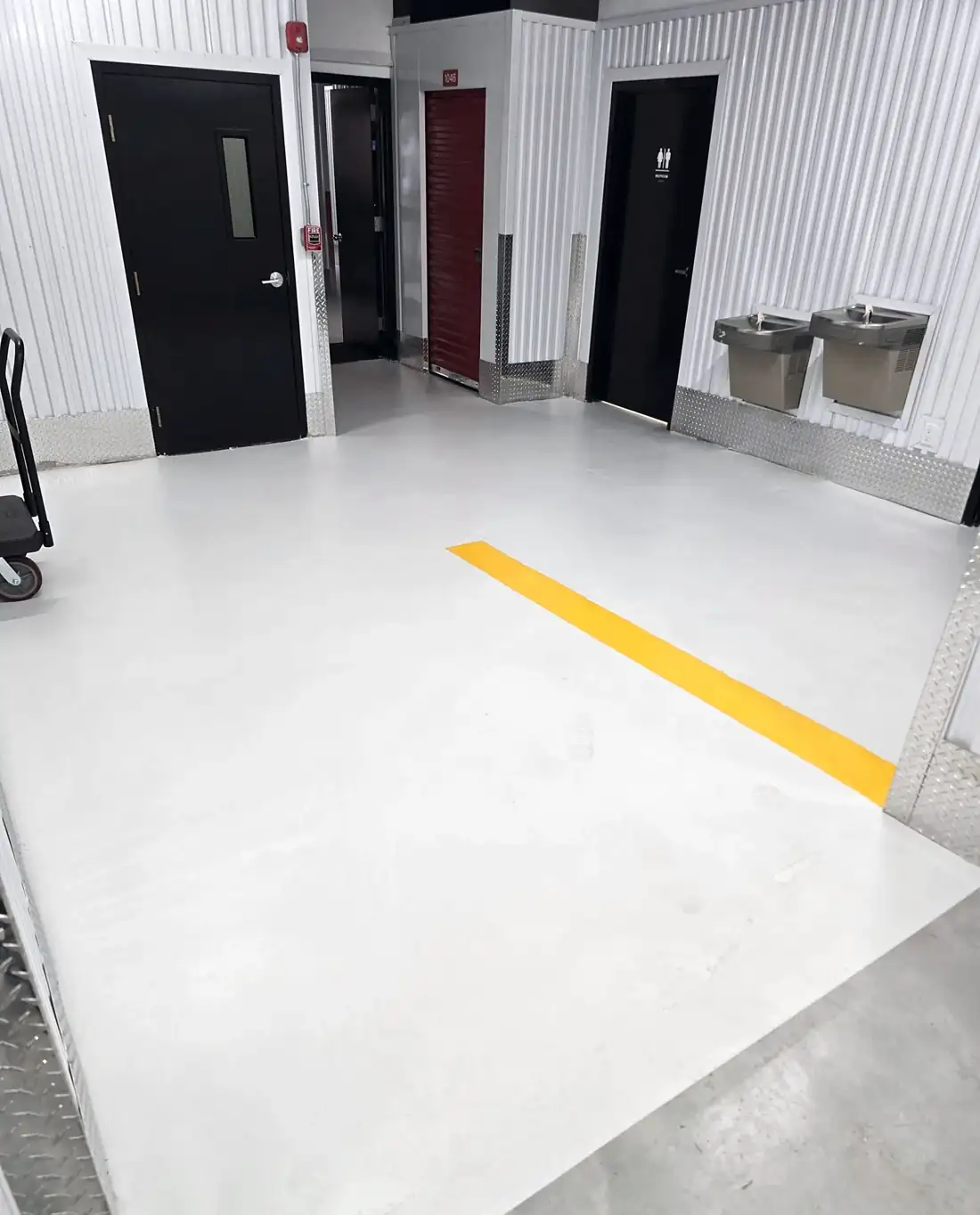 White epoxy corridor floor with yellow safety stripe