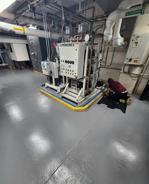 Boiler room after grinding and gray epoxy, 2026