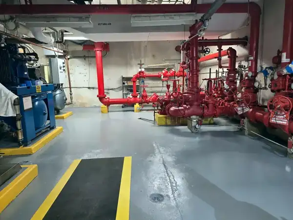 Hospital mechanical room, epoxy with safety striping, 2026