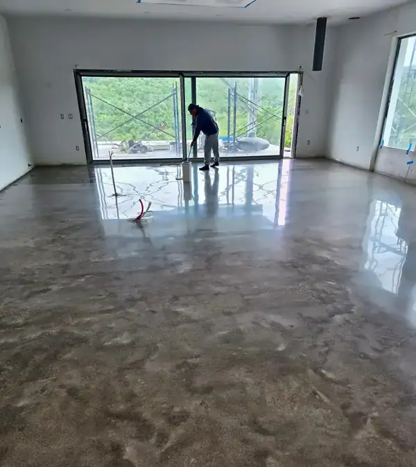 Hand-working a metallic epoxy floor, 2025