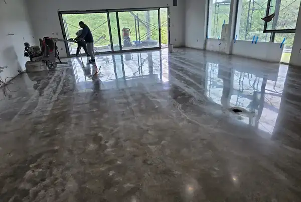 Crew polishing a residential slab, 2025